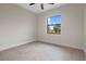 Well-lit bedroom featuring a large window with beautiful outdoor views at 193 Rotonda N Blvd, Rotonda West, FL 33947