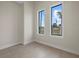 Bright bedroom featuring tile floors and large windows with neighborhood views at 193 Rotonda N Blvd, Rotonda West, FL 33947