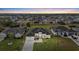 Aerial view of a landscaped property in a residential neighborhood, highlighting the well-kept lawns and organized layout at 193 Rotonda N Blvd, Rotonda West, FL 33947