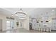 Bright, open kitchen featuring sleek countertops, stainless steel appliances, and a modern lighting fixture at 193 Rotonda N Blvd, Rotonda West, FL 33947