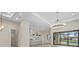 Bright and airy living space featuring an island with seating and stainless steel appliances at 193 Rotonda N Blvd, Rotonda West, FL 33947