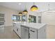Kitchen featuring a large island with seating, stainless steel appliances, and modern cabinetry at 193 Rotonda N Blvd, Rotonda West, FL 33947
