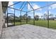 Large open lanai with pavers and a view of the green backyard at 193 Rotonda N Blvd, Rotonda West, FL 33947