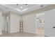 Large living room featuring neutral colors, tile floors, and open layout to the kitchen at 193 Rotonda N Blvd, Rotonda West, FL 33947