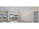 Open-concept living area featuring tile floors, lots of natural light and a view of the outdoors at 193 Rotonda N Blvd, Rotonda West, FL 33947