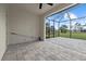 Spacious screened in patio overlooking an expansive green backyard and blue sky at 193 Rotonda N Blvd, Rotonda West, FL 33947