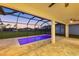 The lanai overlooks the pool and the yard beyond its screened enclosure at 193 Rotonda N Blvd, Rotonda West, FL 33947