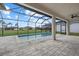 Covered pool with an oversized lanai overlooking backyard and neighboring homes at 193 Rotonda N Blvd, Rotonda West, FL 33947