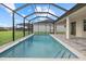 Inviting screened-in pool area with a beautifully paved patio, offering a perfect outdoor retreat at 193 Rotonda N Blvd, Rotonda West, FL 33947