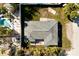 Birds eye view of home, shows roof detail, backyard, and pool area at 203 Peacock Ln # B, Holmes Beach, FL 34217