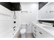 Modern bathroom featuring dual sinks, black hardware, and a shower over the tub at 2225 Alice Rd, Sarasota, FL 34231