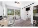 Bright, modern bathroom located off the office area featuring a barn door entrance at 2225 Alice Rd, Sarasota, FL 34231