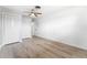 Bedroom featuring wood-look floors, a ceiling fan and a large closet, offering ample storage space at 2225 Alice Rd, Sarasota, FL 34231