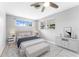 Cozy bedroom with a comfortable bed, natural light, and minimalistic decor at 2225 Alice Rd, Sarasota, FL 34231