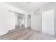 Hallway featuring attractive wood-look floors and stylish doorway trim at 2225 Alice Rd, Sarasota, FL 34231