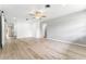 Open-concept living room with plenty of natural light and modern flooring at 2225 Alice Rd, Sarasota, FL 34231