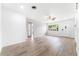 Open-concept living room with plenty of natural light and modern flooring at 2225 Alice Rd, Sarasota, FL 34231