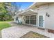 Patio area featuring a classic brick paver design and home access at 2225 Alice Rd, Sarasota, FL 34231