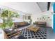 Relaxing sun room with comfortable seating, stylish decor, and plenty of natural light at 2225 Alice Rd, Sarasota, FL 34231
