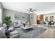 Bright living room showcasing a modern ceiling fan, contemporary decor, and an open floor plan at 2303 Stratford Dr, Sarasota, FL 34232