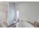 Bright bathroom featuring a soaking tub and separate shower at 2425 21St St # B, Sarasota, FL 34234