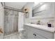 Updated bathroom with stylish vanity, modern fixtures, and a tiled walk-in shower at 2425 21St St # B, Sarasota, FL 34234