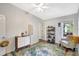 Neutral bedroom with ceiling fan, area rug, and a comfy chair at 2425 21St St # B, Sarasota, FL 34234