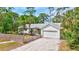 Lovely single-story home with a well-manicured lawn and a driveway leading to the garage at 2425 21St St # B, Sarasota, FL 34234