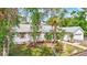 Well-maintained home with lush greenery, a fenced yard, and a welcoming curb appeal at 2425 21St St # B, Sarasota, FL 34234