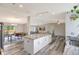Bright kitchen with a large island, granite countertops, and an open layout to dining and living areas at 2425 21St St # B, Sarasota, FL 34234