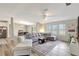 Spacious living room featuring a large sectional sofa, natural light, and open layout at 2425 21St St # B, Sarasota, FL 34234