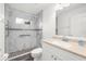 Bright bathroom features a walk-in shower with marble tile and glass door, enhancing accessibility at 2665 Chipley Ave, North Port, FL 34286