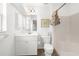 Bright bathroom with white fixtures, and shower-tub combo at 2665 Chipley Ave, North Port, FL 34286
