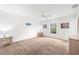 Light-filled bedroom with ceiling fan and carpeted floors at 2665 Chipley Ave, North Port, FL 34286