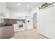 Bright kitchen with white cabinets and appliances at 2665 Chipley Ave, North Port, FL 34286