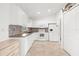 Kitchen features white cabinetry, tile flooring, and a seamless design for modern living at 2665 Chipley Ave, North Port, FL 34286