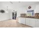 Eat-in kitchen with tile floors, white cabinets, and stainless steel appliances at 2665 Chipley Ave, North Port, FL 34286