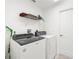 Laundry room featuring newer white washer and dryer at 2665 Chipley Ave, North Port, FL 34286