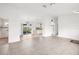 View of living room, kitchen, and lanai with tile flooring creating cohesive flow at 2665 Chipley Ave, North Port, FL 34286