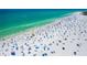 Expansive aerial view of a vibrant, bustling beach filled with people enjoying the sun and surf at 2909 Concord St, Sarasota, FL 34231