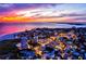 Sunset aerial view showcasing the vibrant coastal city with colorful skies over the ocean at 2909 Concord St, Sarasota, FL 34231