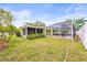Spacious backyard featuring a large, screened pool area and a lovely patio at 2909 Concord St, Sarasota, FL 34231