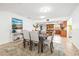 Elegant dining room with seating for six and view to the kitchen, complemented by a stylish rug at 2909 Concord St, Sarasota, FL 34231