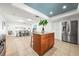 Open kitchen view with stainless steel refrigerator and a center island leading to the dining area at 2909 Concord St, Sarasota, FL 34231
