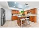 Well-equipped kitchen with granite countertops, stainless steel appliances, an island, and ample cabinet space at 2909 Concord St, Sarasota, FL 34231