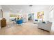 Bright and airy living room with tile flooring, modern furniture, and sliding glass doors to the patio at 2909 Concord St, Sarasota, FL 34231