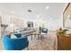 Spacious living room with modern decor, including plush seating, patterned rugs, and abundant natural light at 2909 Concord St, Sarasota, FL 34231