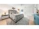 Spacious main bedroom with a plush bed, bedside tables, and ensuite bathroom access, enhanced by soft lighting at 2909 Concord St, Sarasota, FL 34231