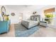 Cozy main bedroom boasts a serene decor, a neutral color palette, and natural light from large windows at 2909 Concord St, Sarasota, FL 34231