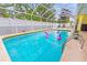 Screened in pool featuring fun flamingo pool floats and lots of room to swim at 2909 Concord St, Sarasota, FL 34231